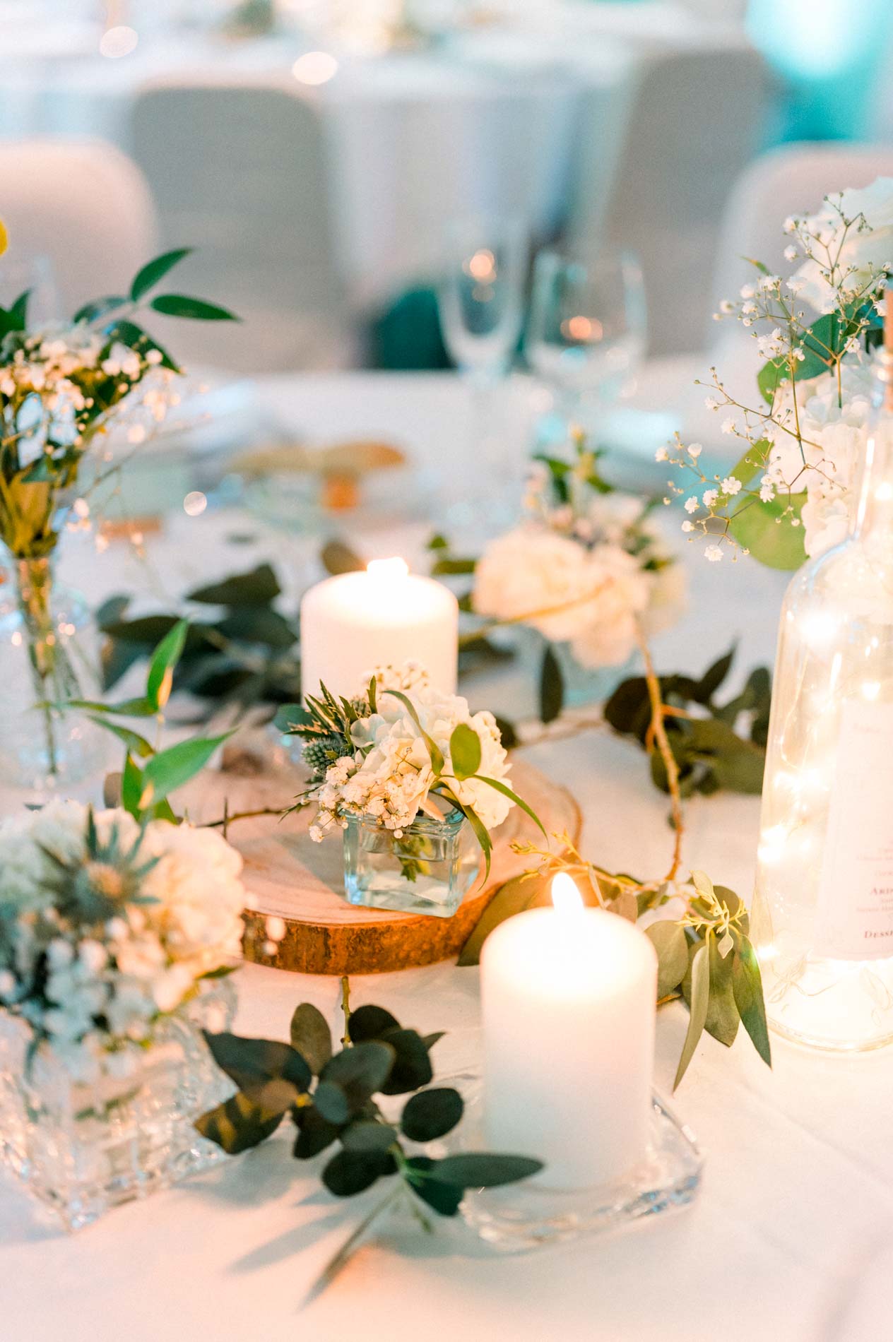 White rose and candle centrepiece for the wedding dinner