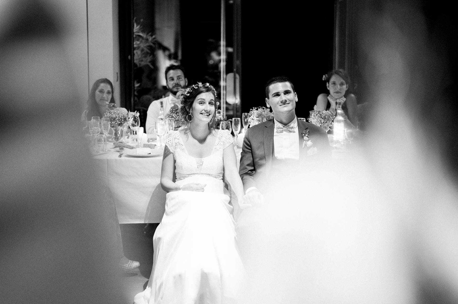 The couple at their table during dinner, in black and white