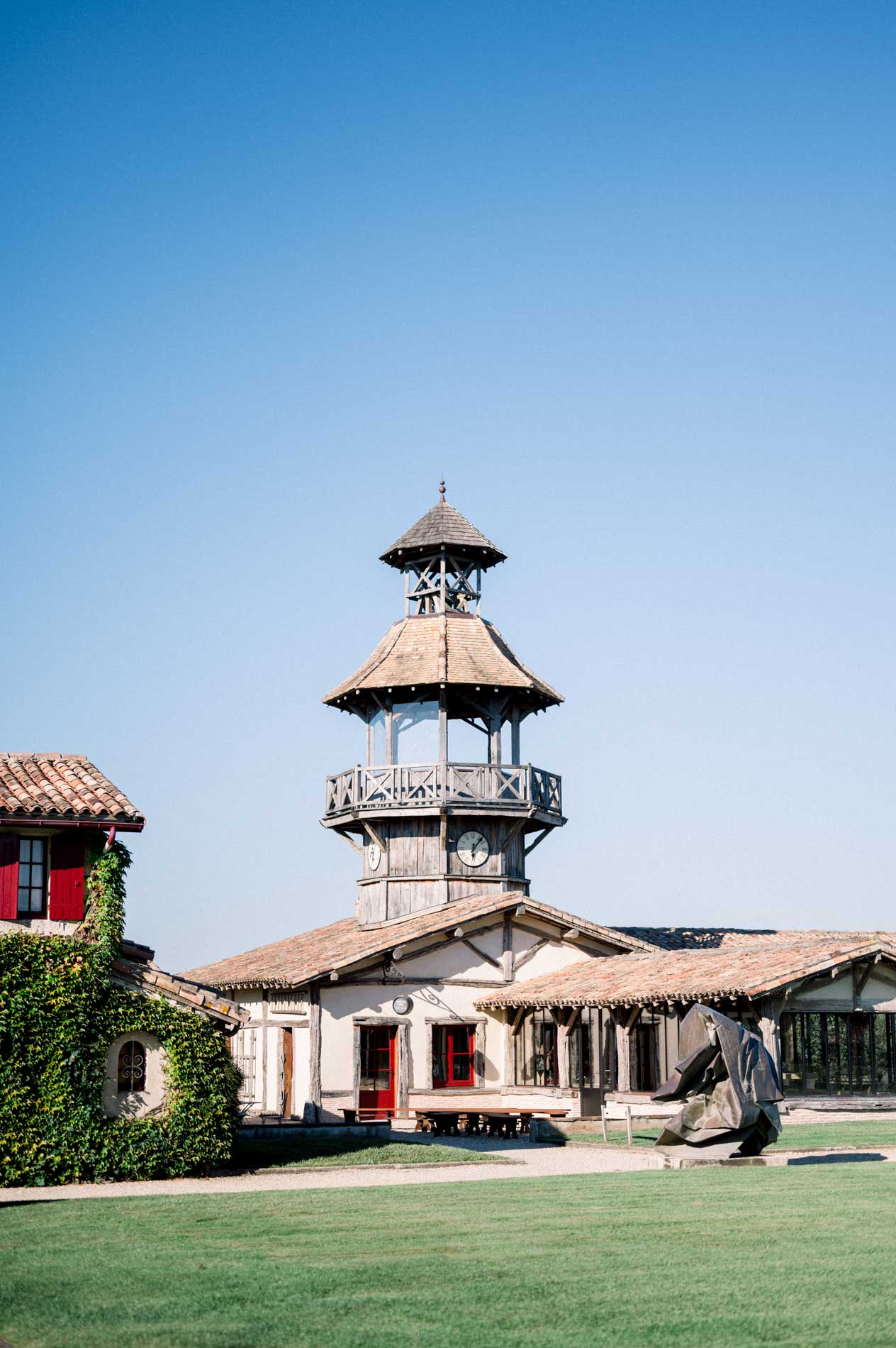 The belvedere tower of Château Smith Haut Lafitte rising above the cocktail lawn