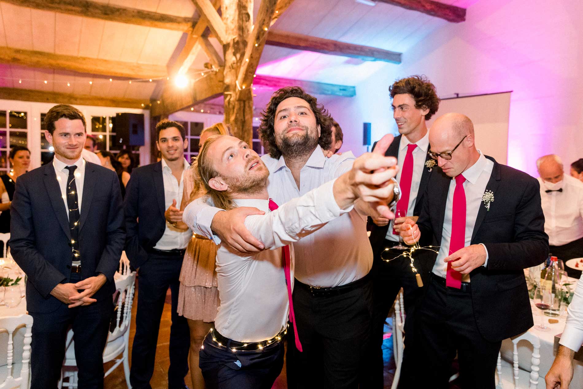 Guests dancing and singing along during the wedding party