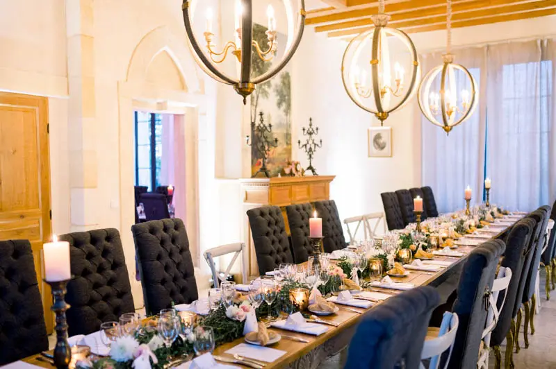 Reception room set for the wedding dinner at Château de Garde
