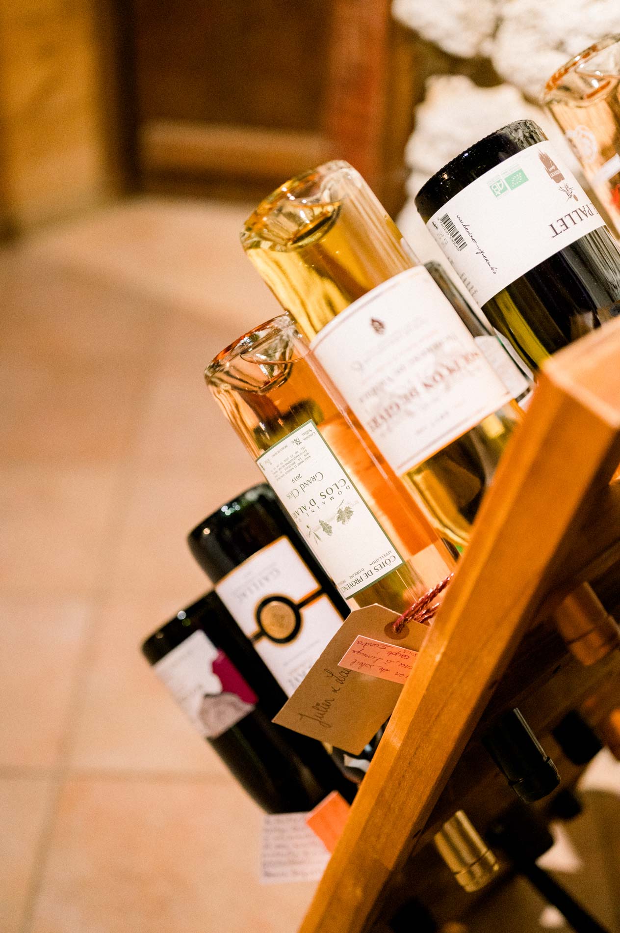 Wine and champagne bottles stacked in a wooden rack