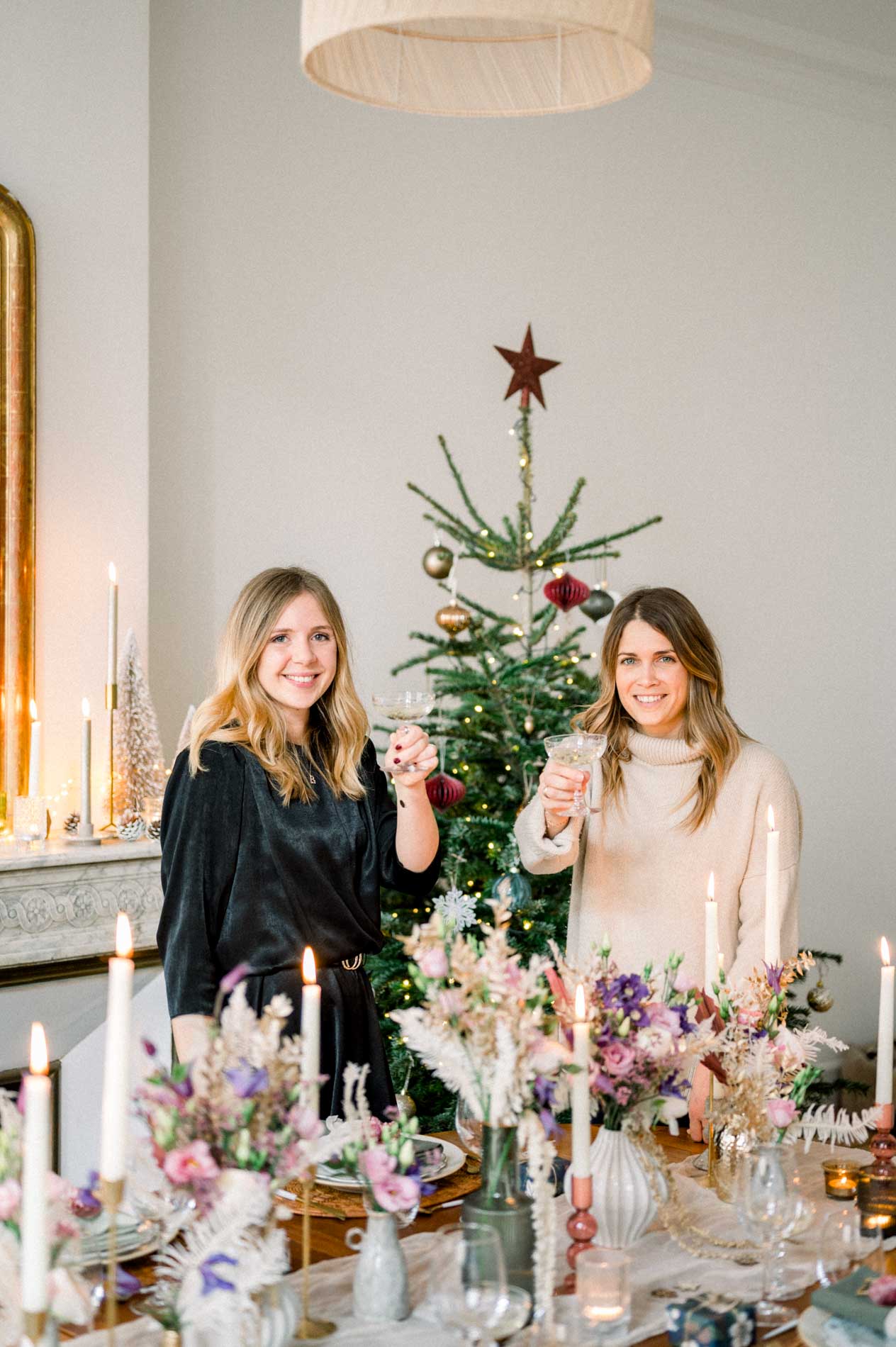 The Loli Events team raising a toast by the table and Christmas tree