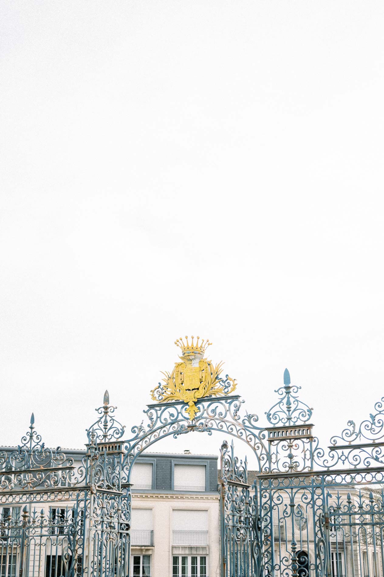 Gilded wrought-iron entrance gate of the Parc Bordelais in Bordeaux