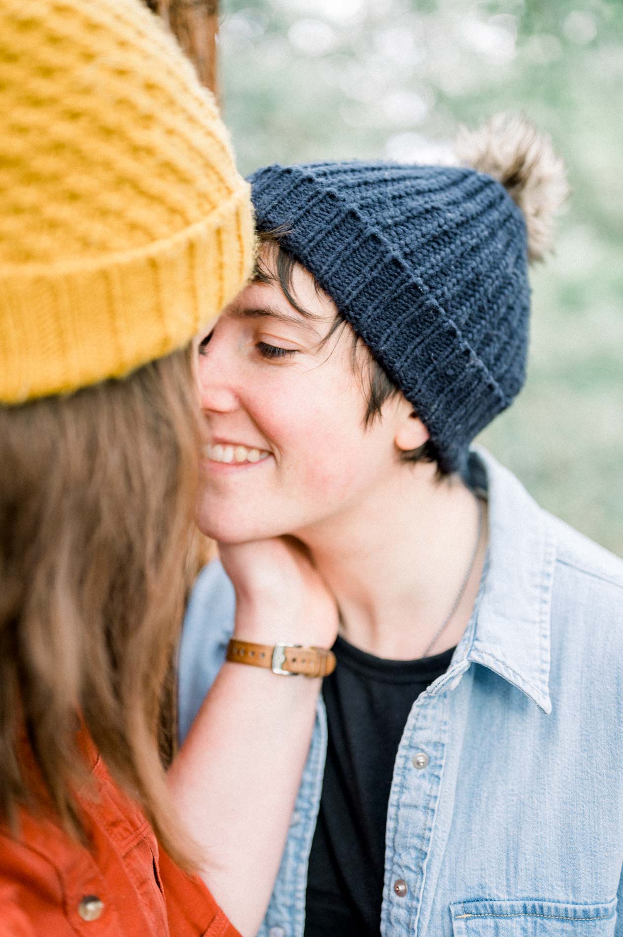 Close-up of the smiling couple pressed cheek to cheek