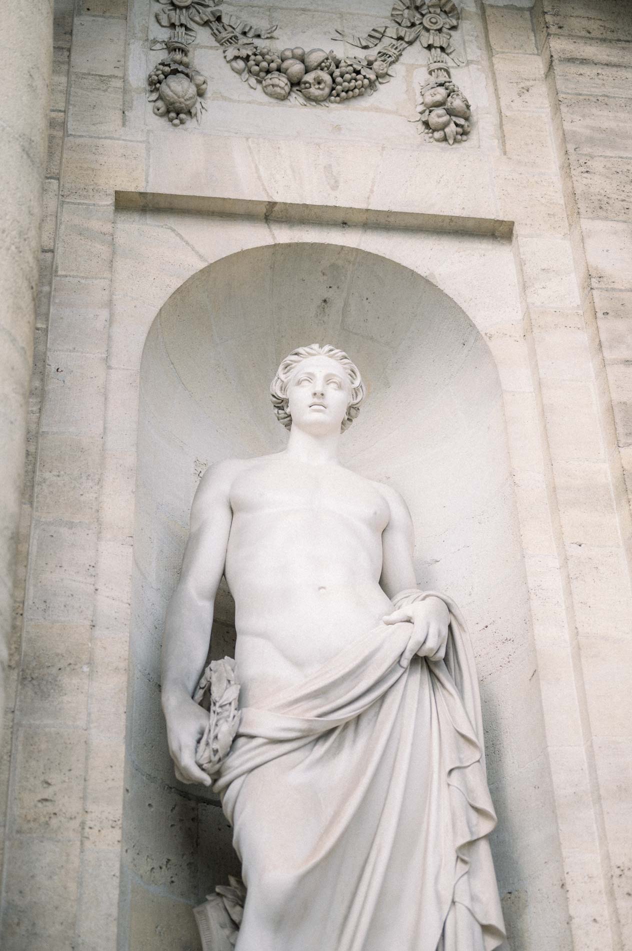 Marble statue in a niche in the courtyard of Bordeaux city hall