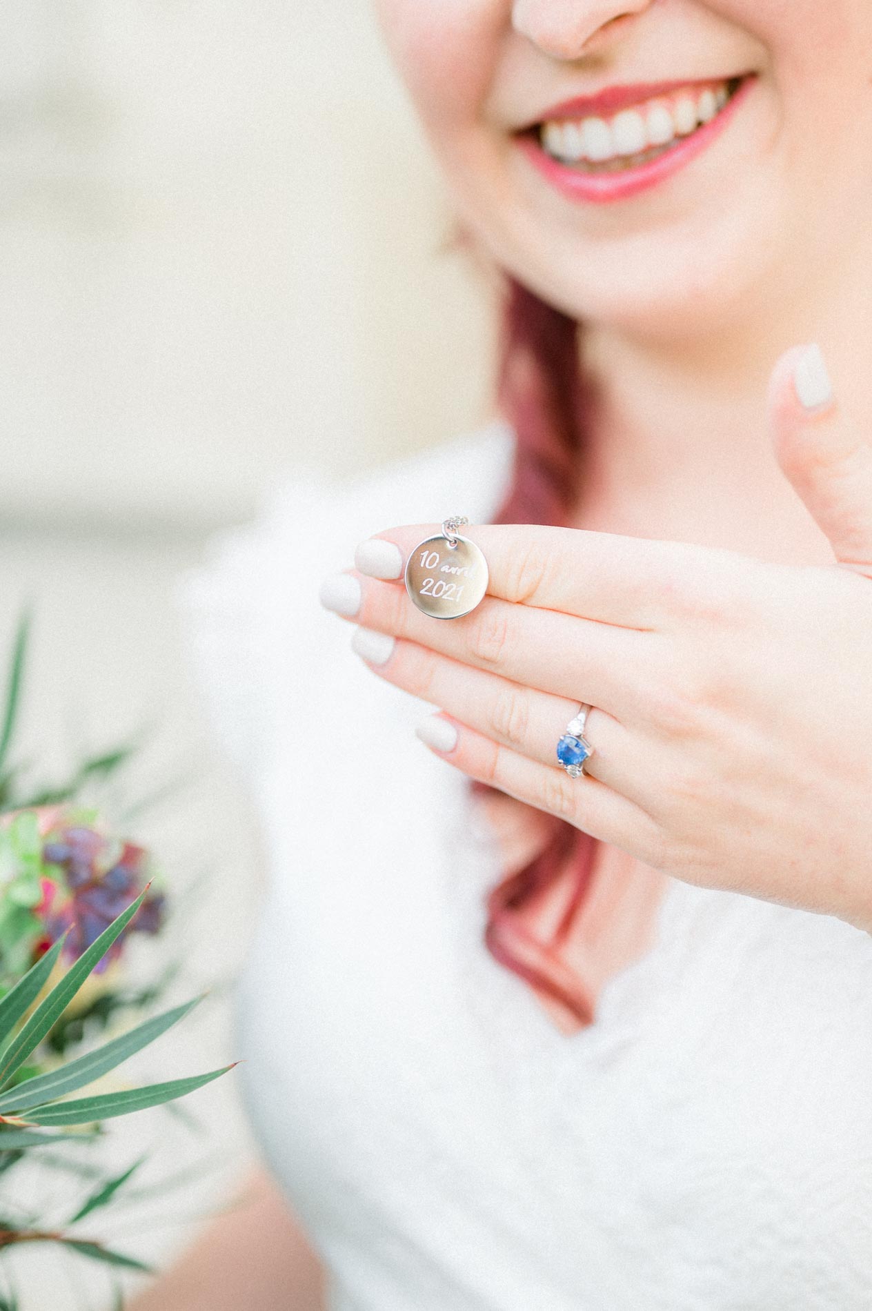 Smiling bride showing her engagement ring and vintage ring