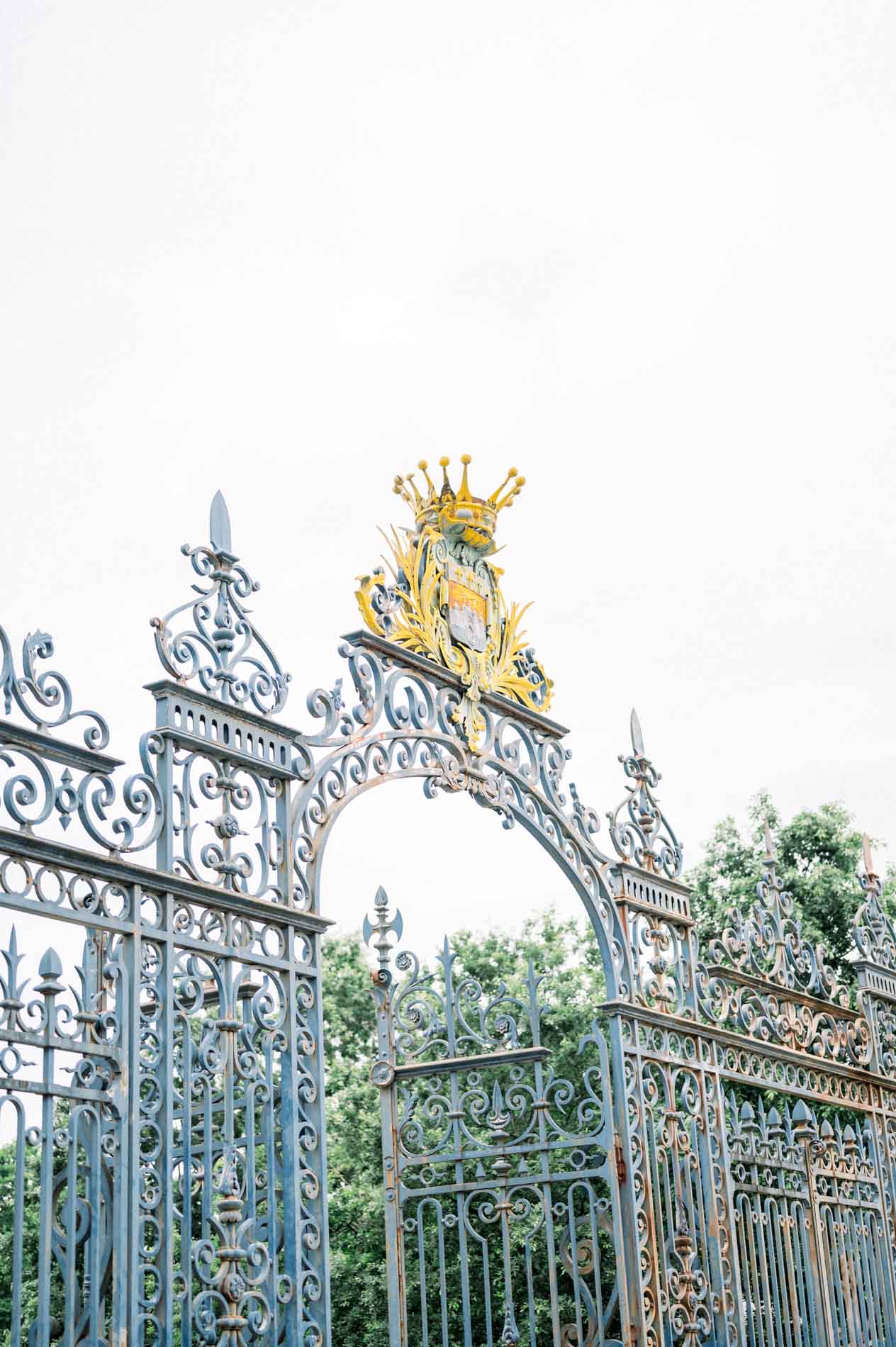 The gilded wrought iron entrance gate of Parc Bordelais in Bordeaux