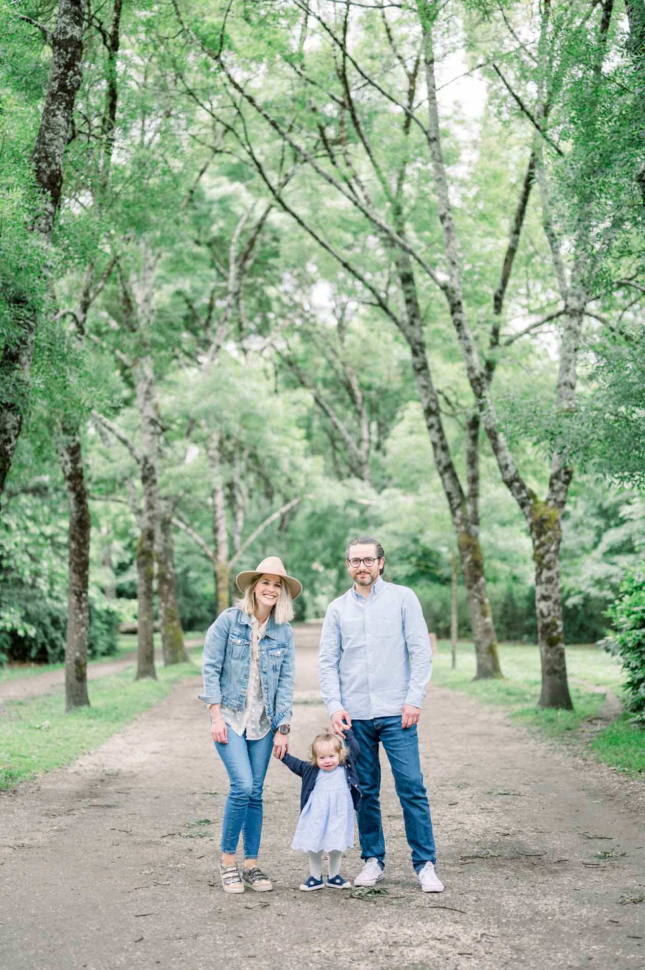 Julie, Stan and Cassandre walking together along the shaded park path