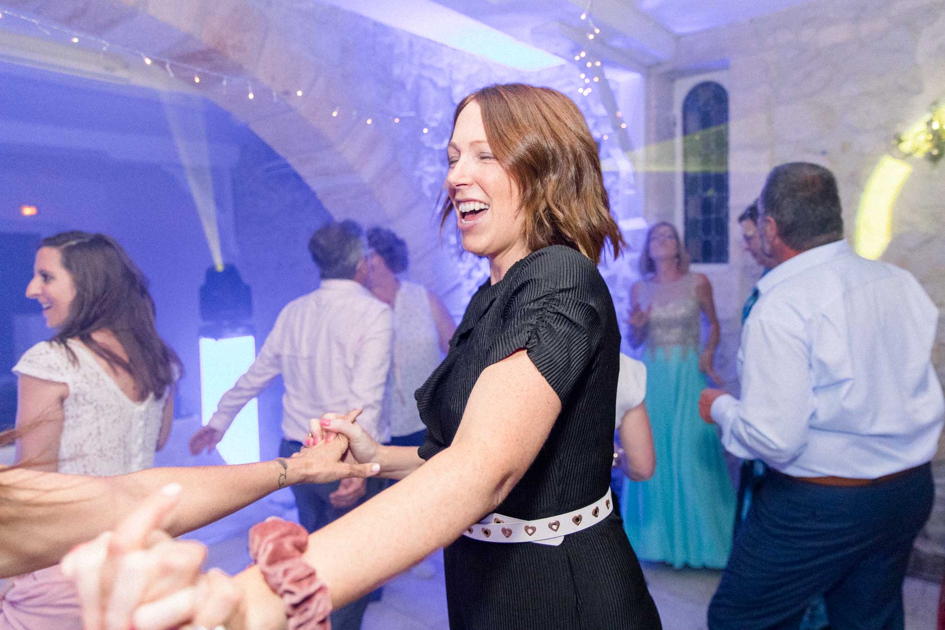 Fanny of l'Instant F dancing with guests during the wedding party