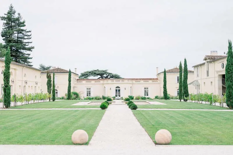 Formal French garden and central path leading to the Château Gassies facade