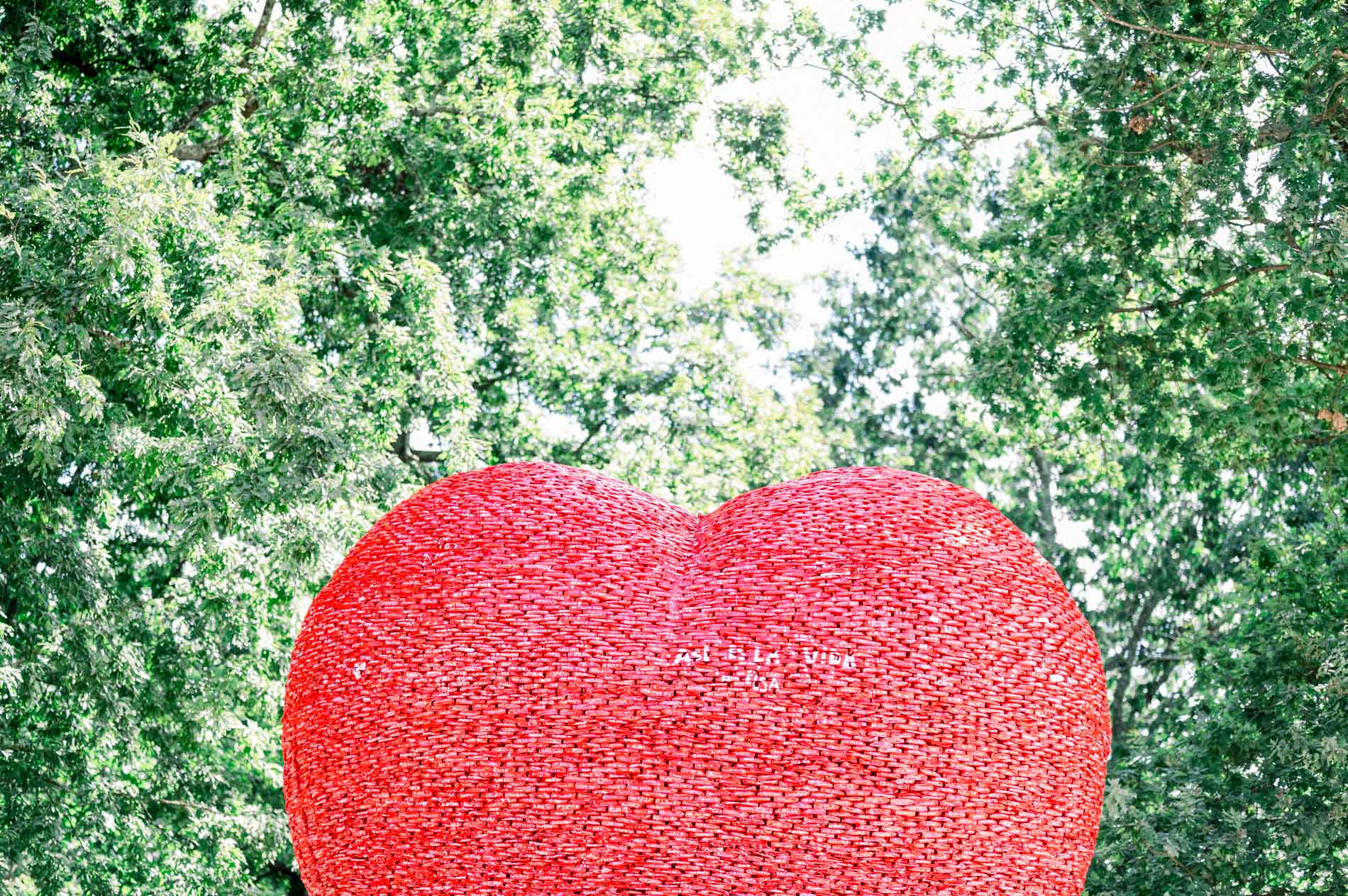 Giant red heart in a Bordeaux park, the setting for a couple photo session