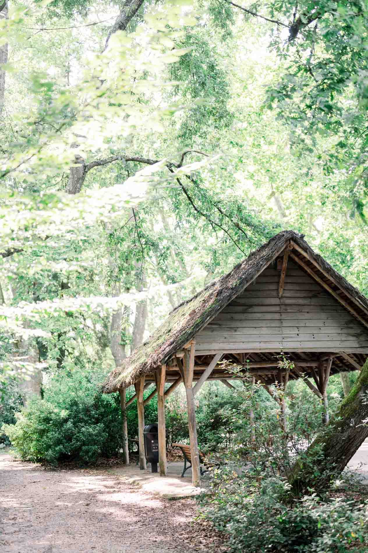 Rustic wooden shelter under the trees of the Parc Bordelais