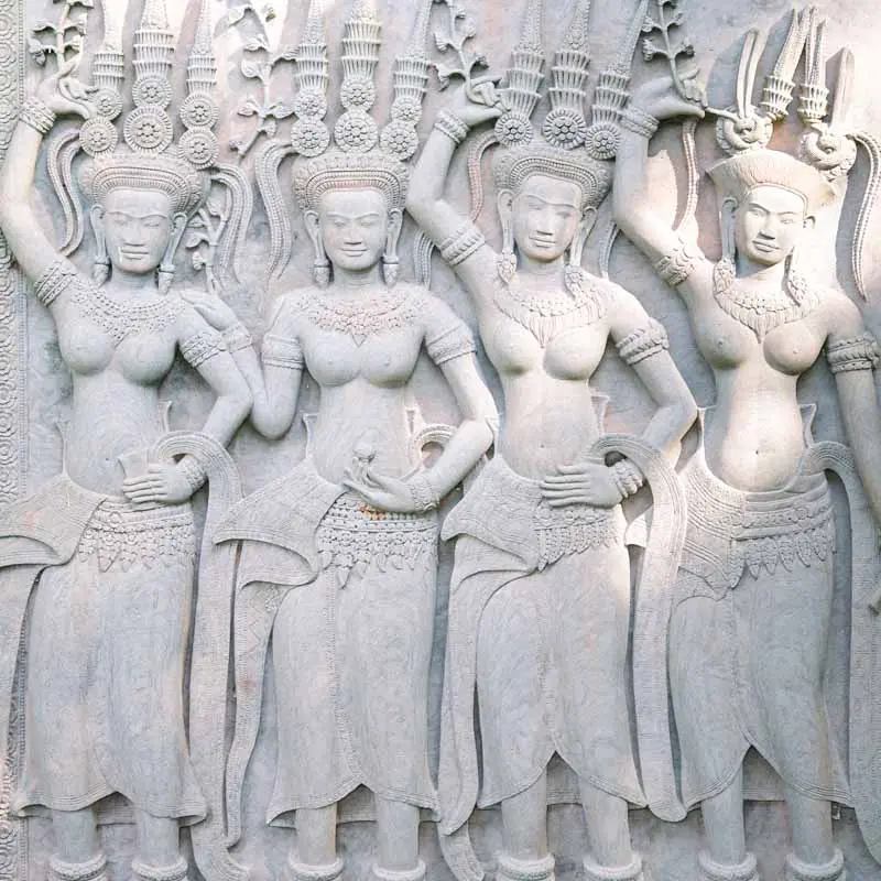 Stone bas-relief of carved dancers decorating the grounds of Villa la Tosca
