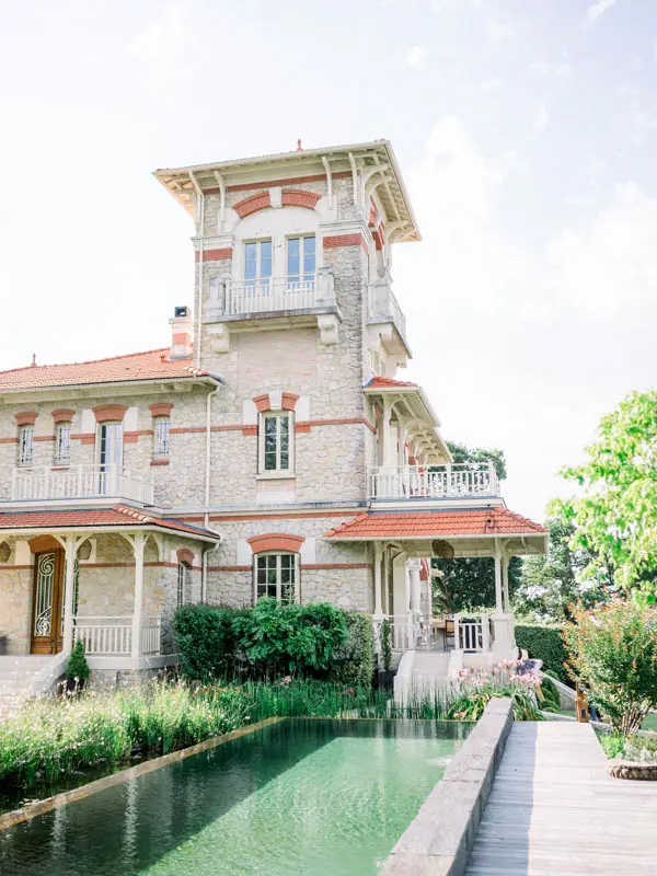 The tower of Villa la Tosca rising above its long garden pool