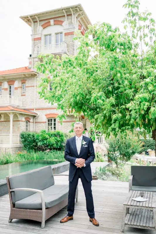 The groom waiting on the villa terrace for the first look