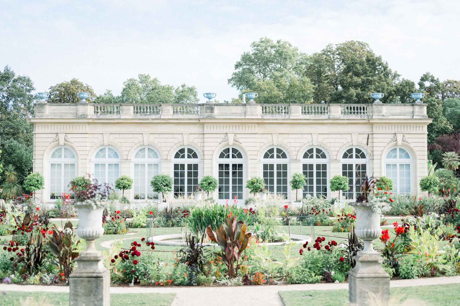 Classical façade and flowerbeds in the gardens of Parc de Bagatelle, Paris