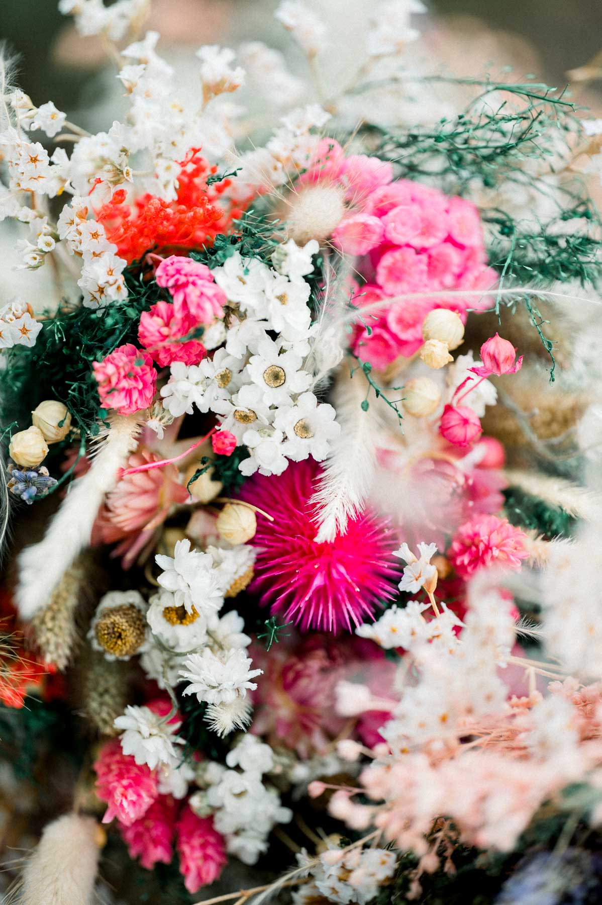 Close-up of a pink, red and white dried-flower bouquet
