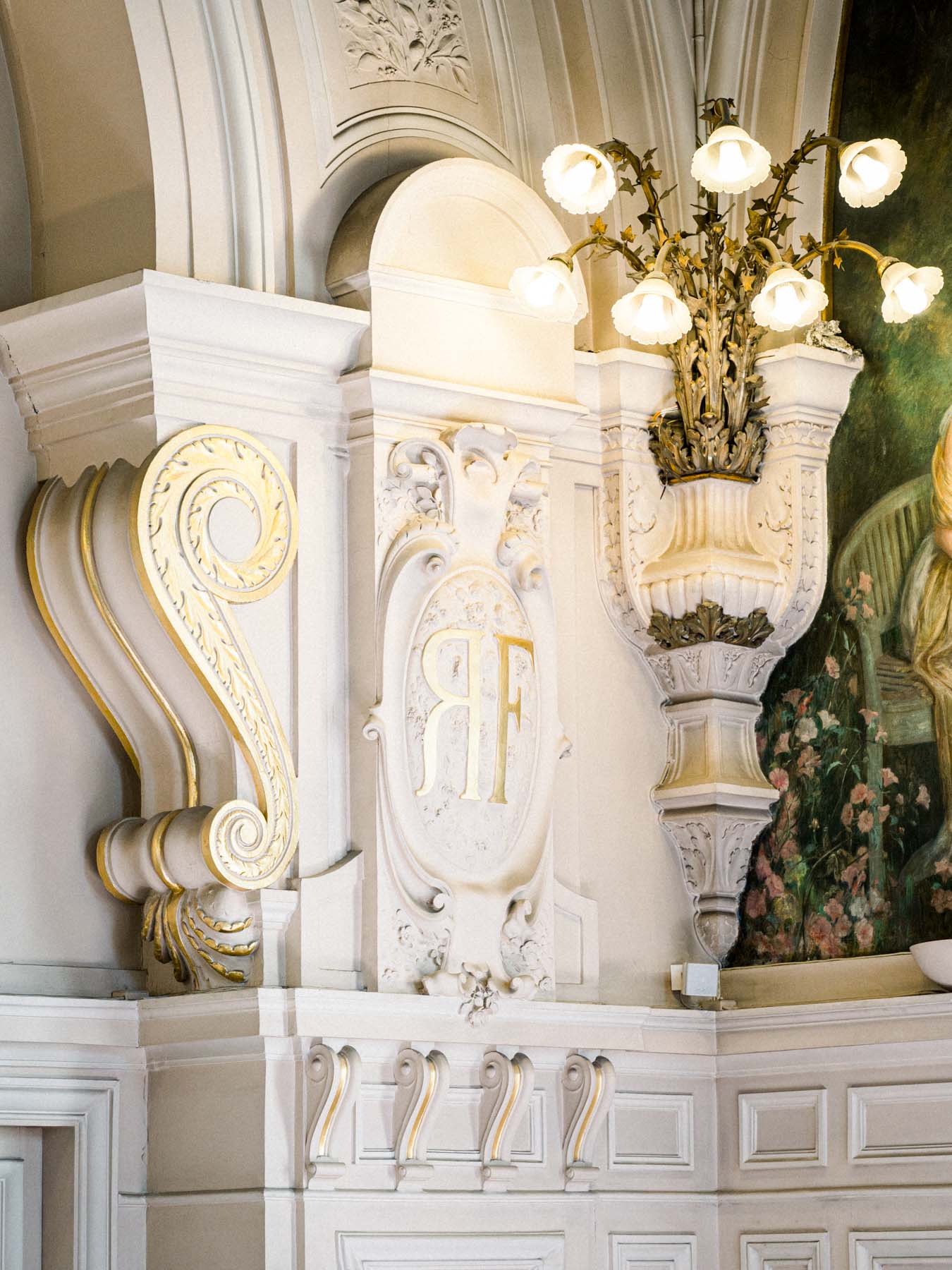 Gilded mouldings and chandelier in a stately room of Neuilly-sur-Seine town hall
