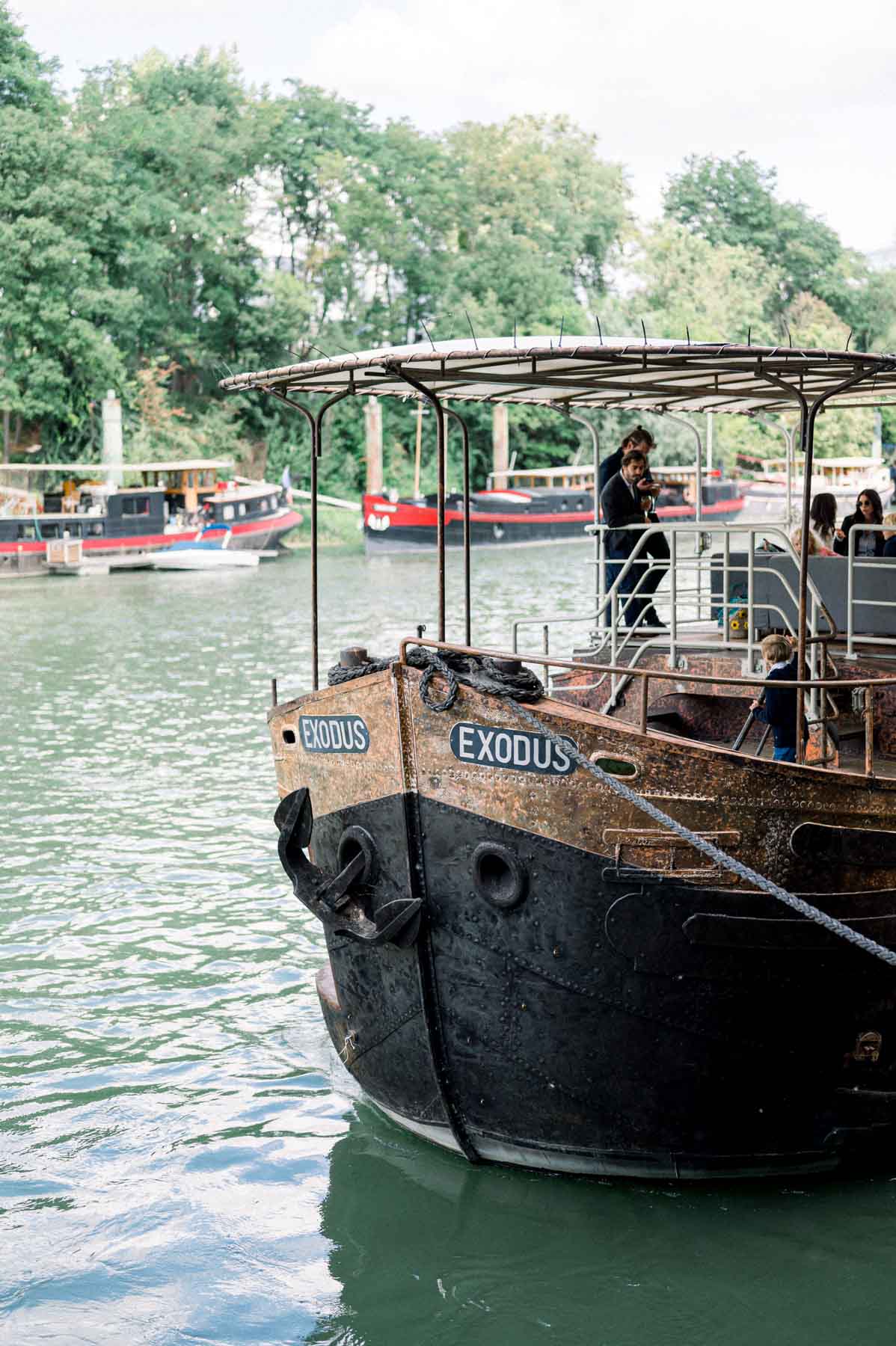 Vintage barge carrying wedding guests along the Seine for the drinks reception
