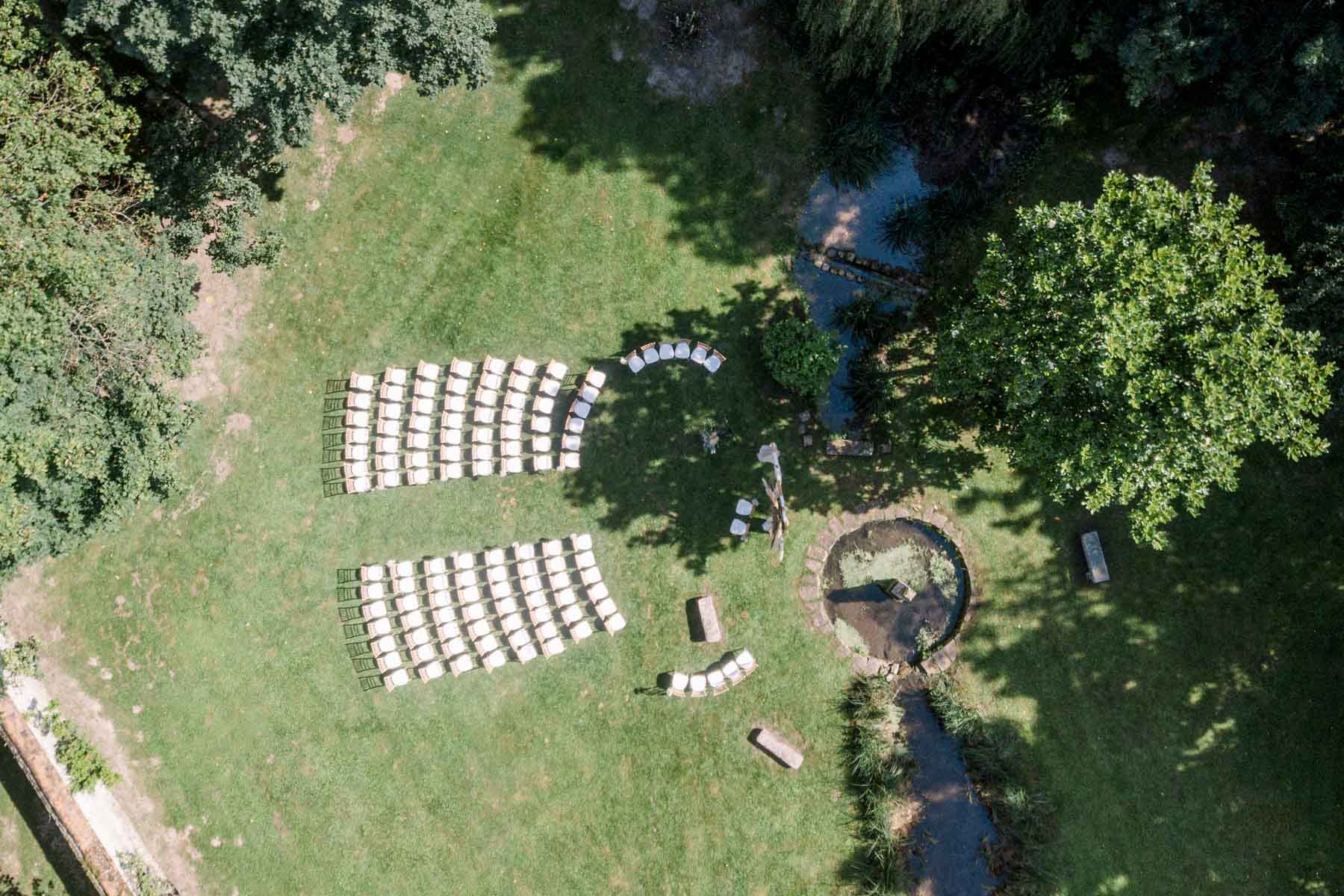 Aerial view of the outdoor ceremony chairs set out on the mill lawn