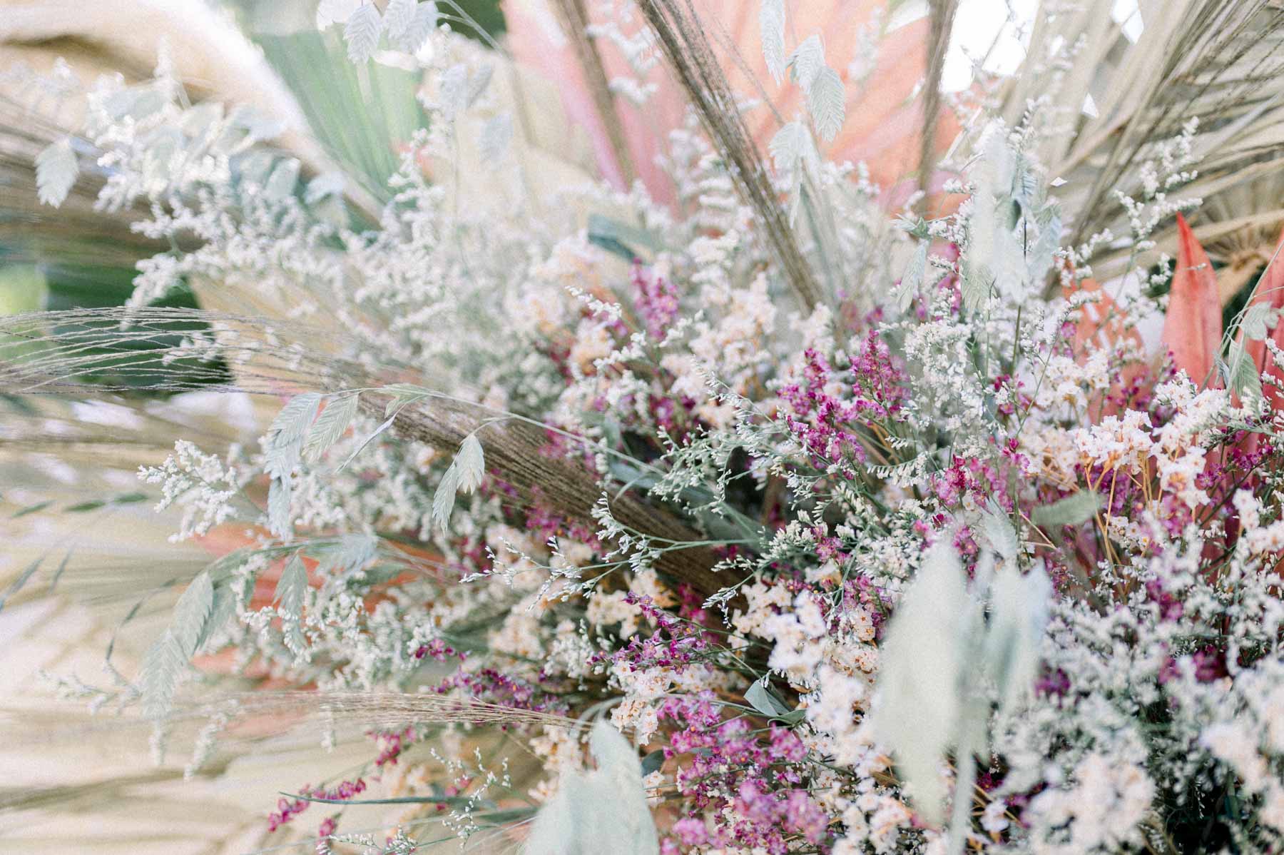 Close-up of a dusty pink and white dried-flower arrangement
