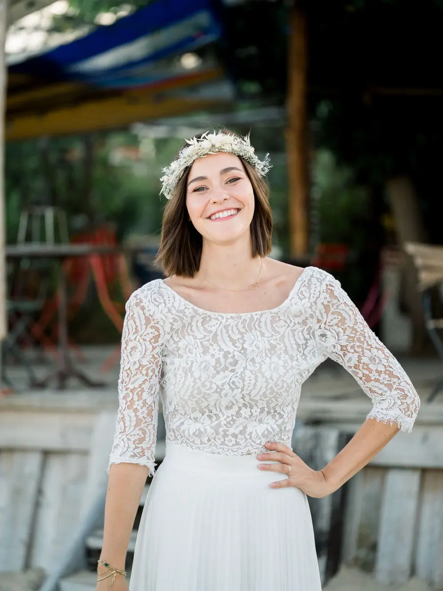 Portrait of the smiling bride wearing a dried flower crown
