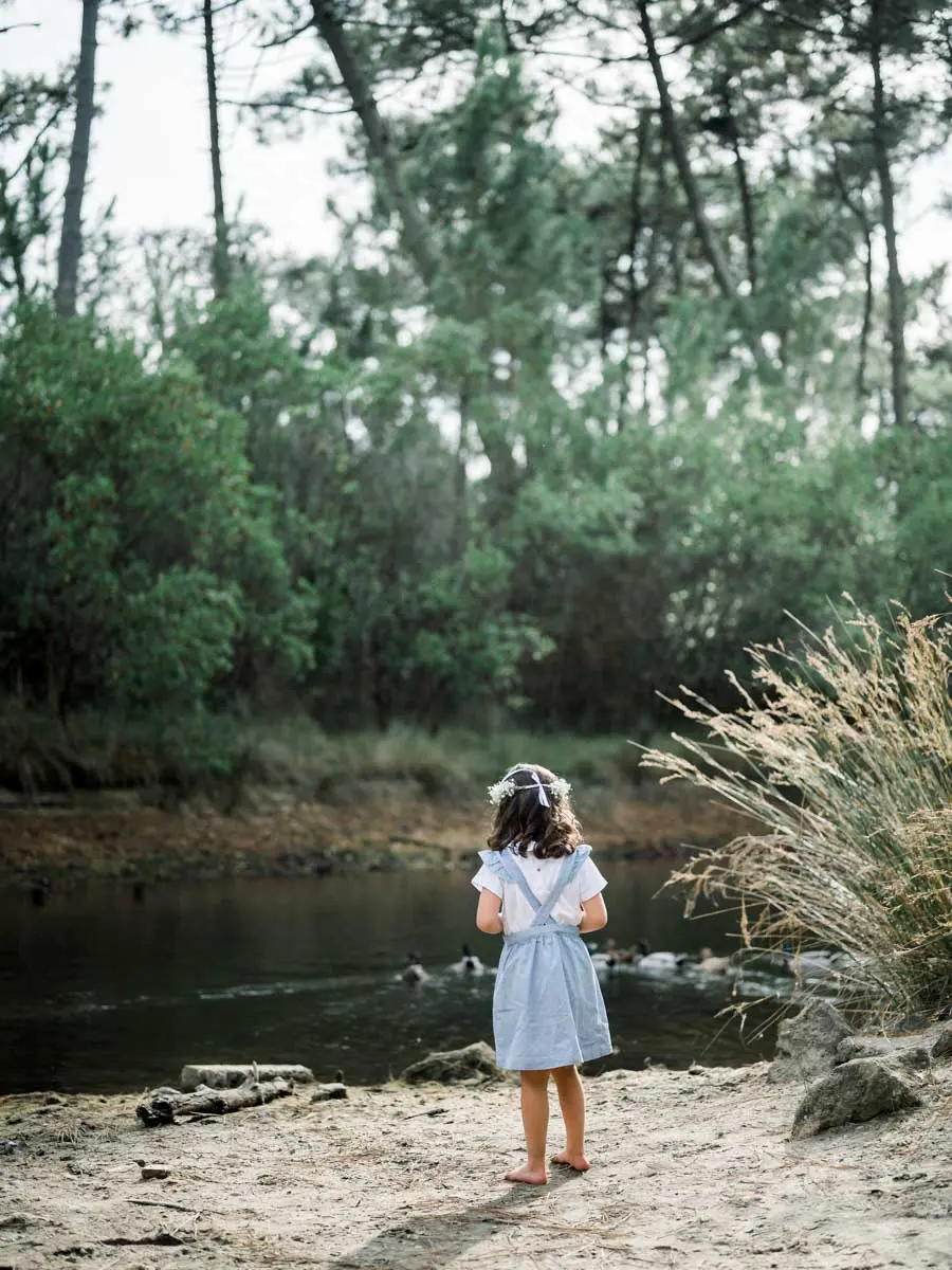 Little girl at the water's edge at the Piraillan reservoirs
