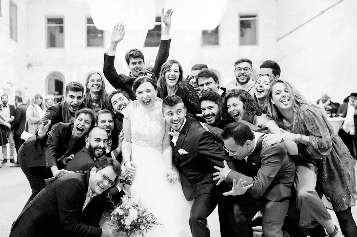 Wild group photo of the couple and their friends, in black and white