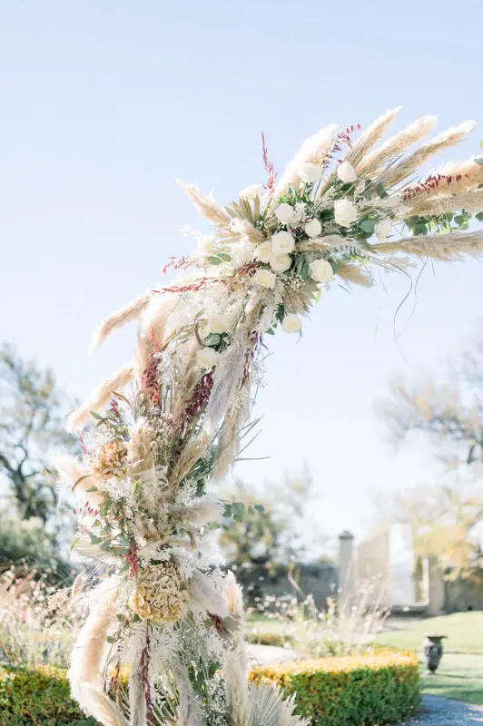 Close-up of the wedding arch made of dried flowers and pampas grass