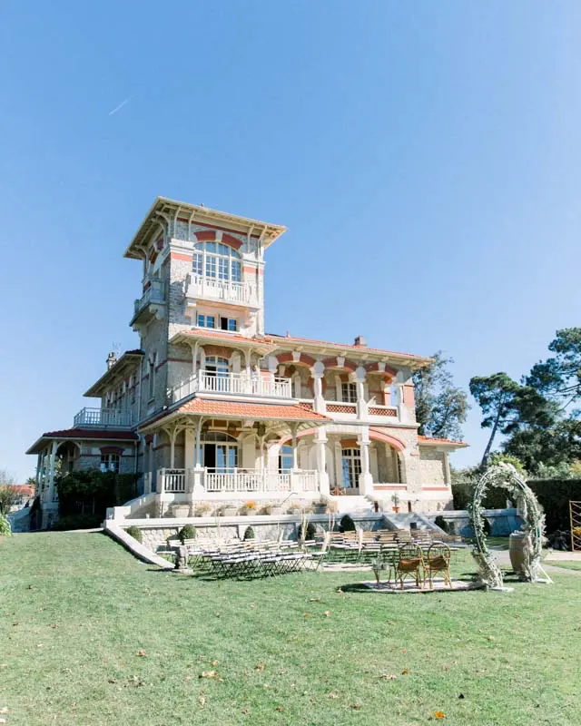 Villa La Tosca and its tower above the lawn set up for the ceremony
