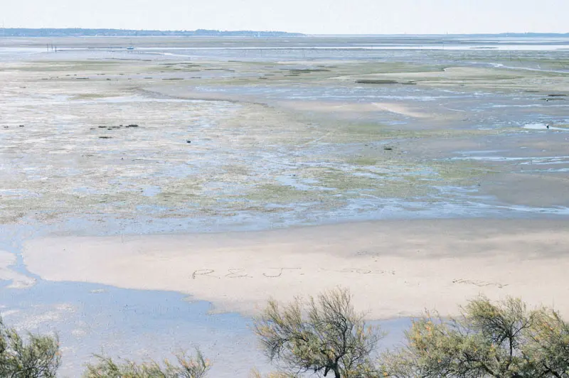 Arcachon Bay at low tide with sandbanks and calm water in the sun