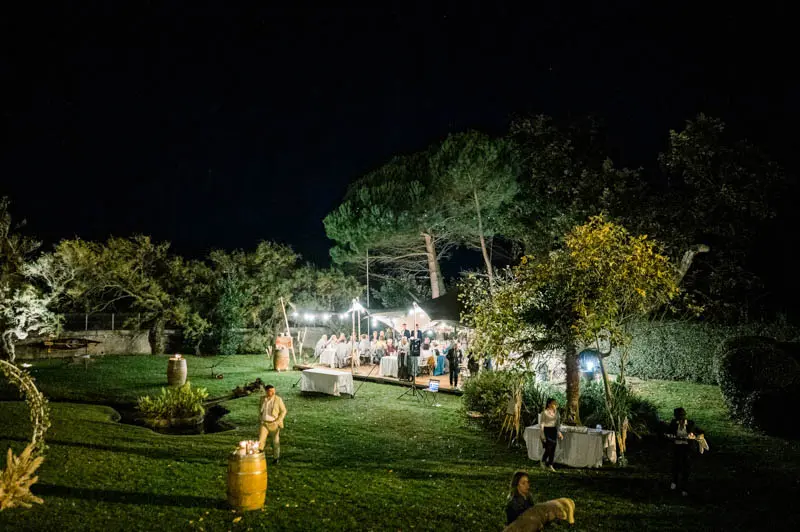 Villa La Tosca garden at night, the lit tent in the distance