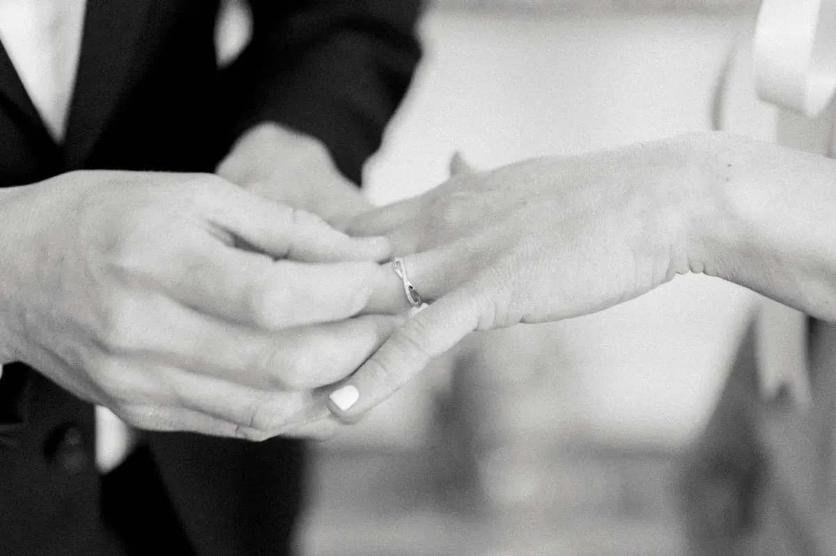Exchange of rings at the civil wedding, in black and white