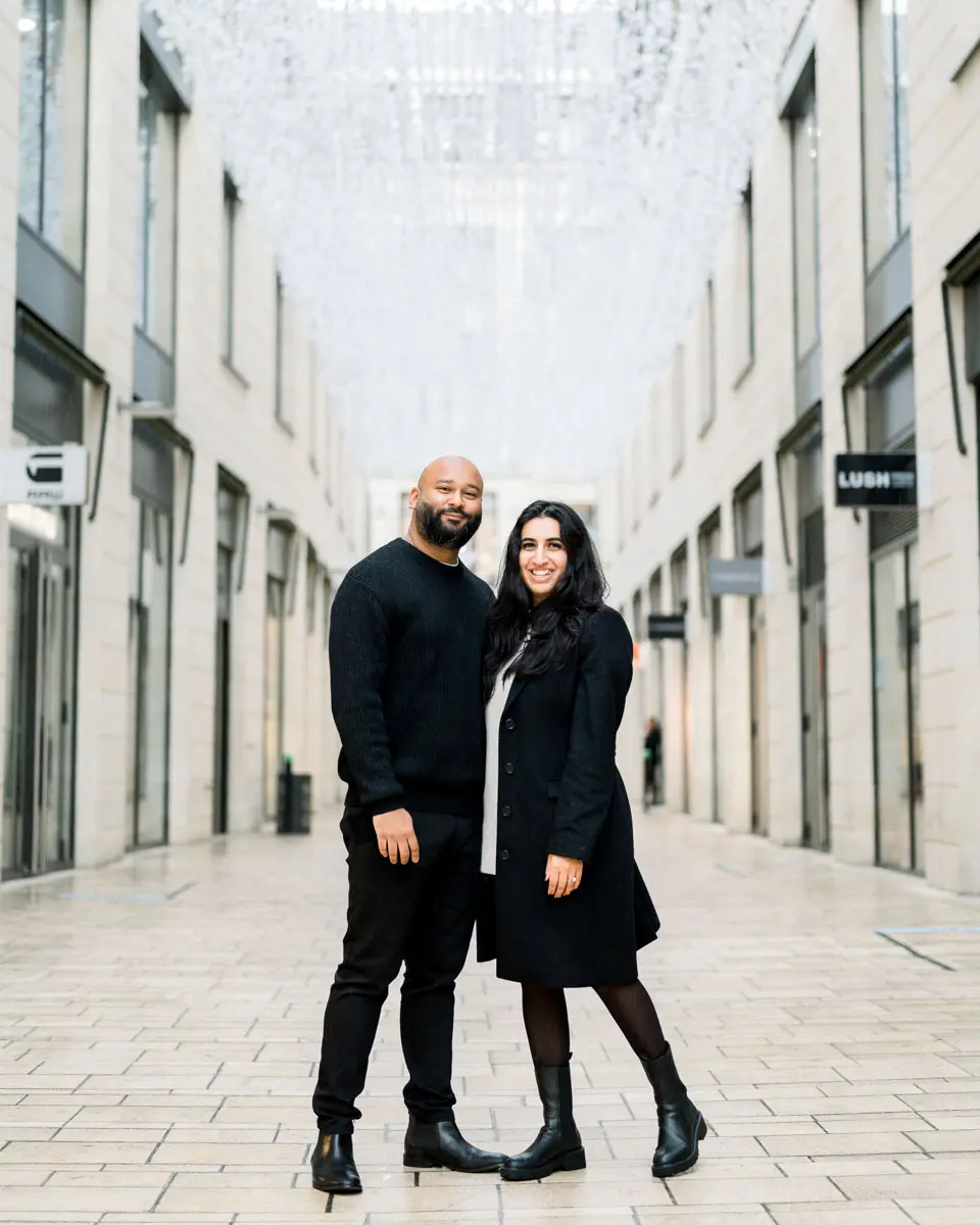Engaged couple hand in hand on a pedestrian street in Bordeaux