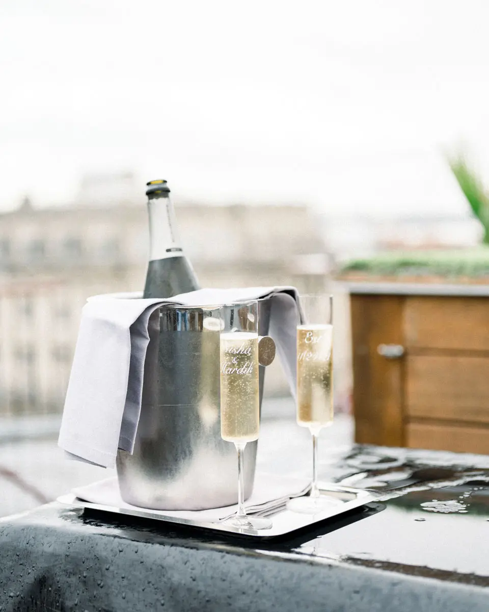 Champagne bucket and two glasses on the Night Beach rooftop terrace