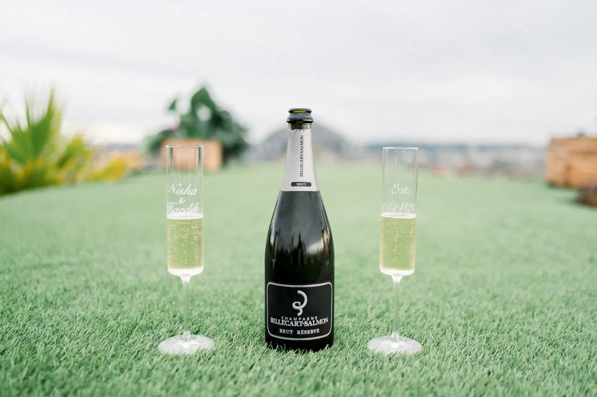 Champagne bottle and glasses set on the rooftop terrace lawn