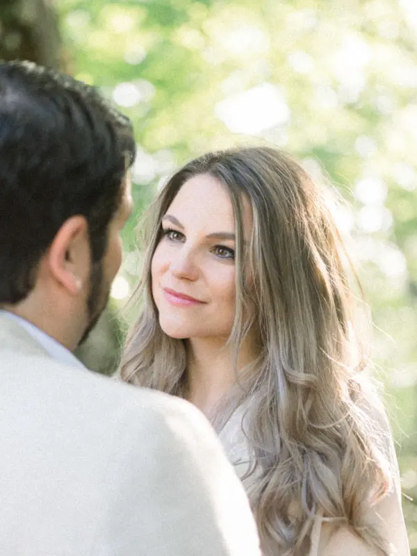 The fiancée gazing tenderly at her future husband in soft light