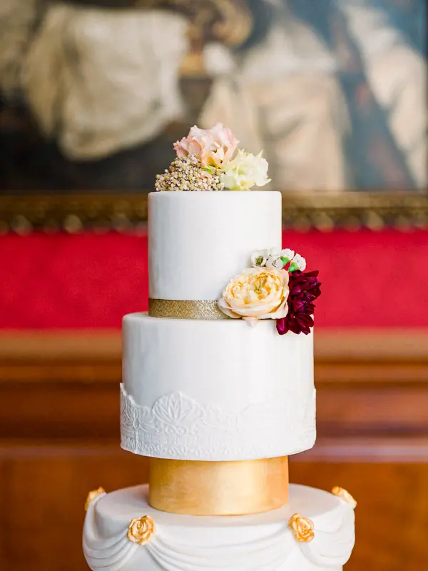 White and gold wedding cake at Château Pape Clément