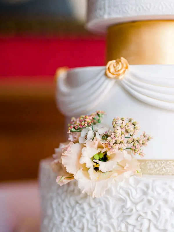 White and gold wedding cake at Château Pape Clément