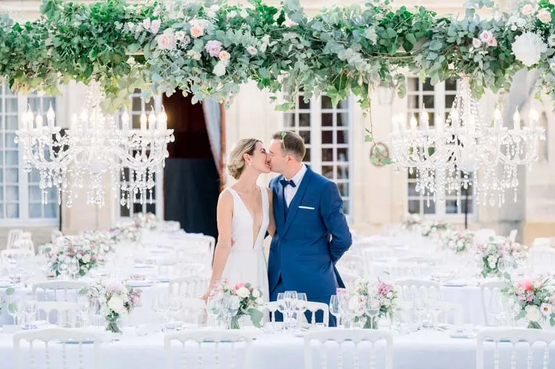 Bride and groom in front of the orangery at Château Pape Clément