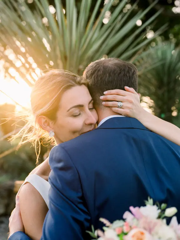 Couple embracing at sunset, Château Pape Clément