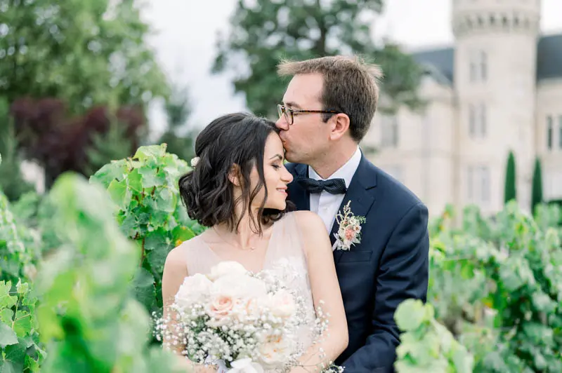 Bride and groom in the vineyards of Château Pape Clément