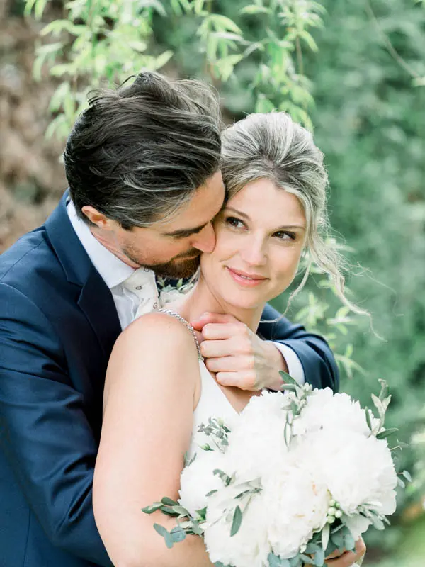 Couple embracing in the gardens of Villa La Tosca