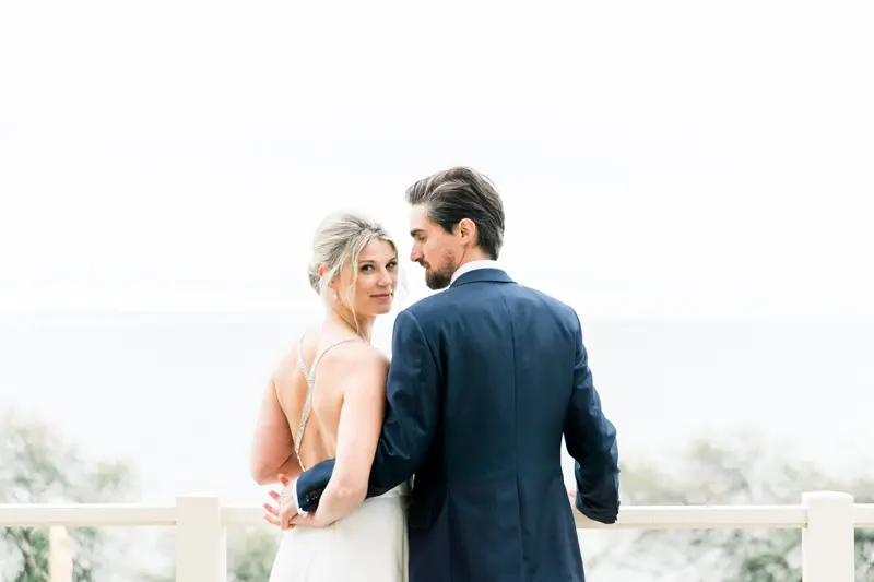 Bride and groom facing Arcachon Bay from the Villa's terrace
