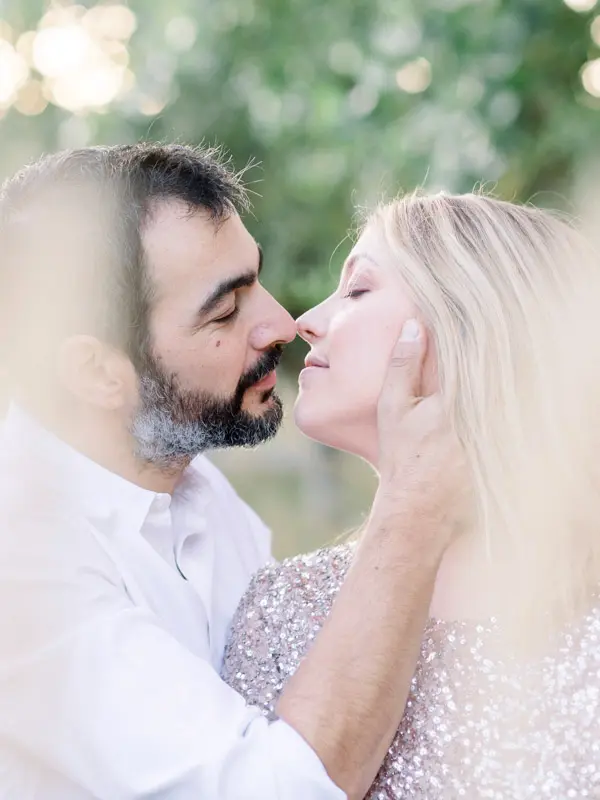 Couple nose to nose during a maternity session at the Sources de Caudalie