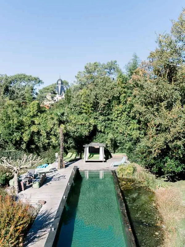 Swimming pool in the gardens of Villa La Tosca, seen from above