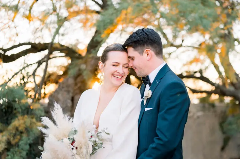 Smiling bride and groom at golden hour, Villa La Tosca