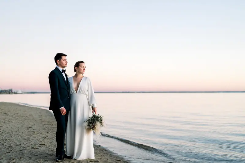Bride and groom on the beach at sunset, Arcachon Bay