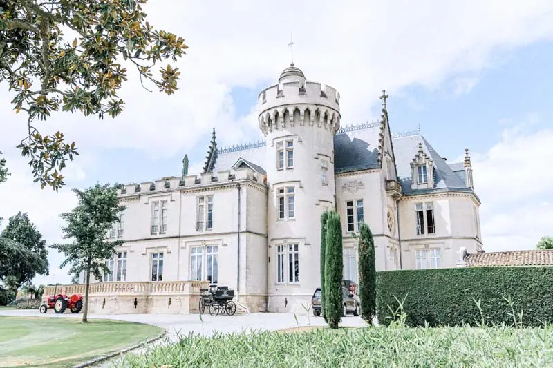 Neo-Gothic Château Pape Clément with a vintage wedding car